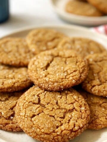 close up of ginger crinkle cookies on a plate.