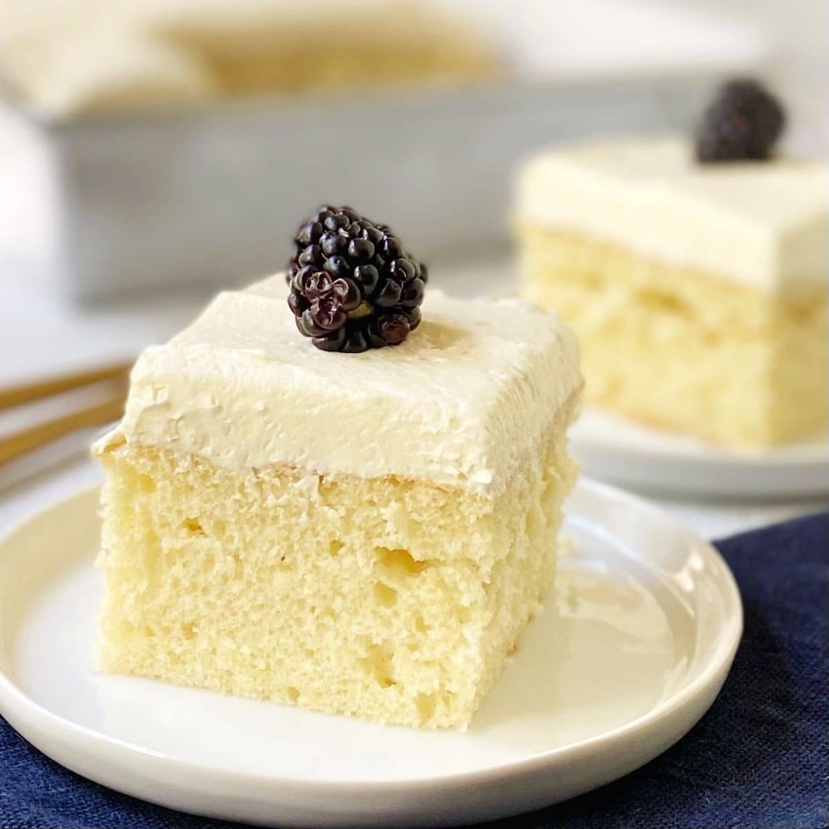 slice of vanilla almond cake on a plate.