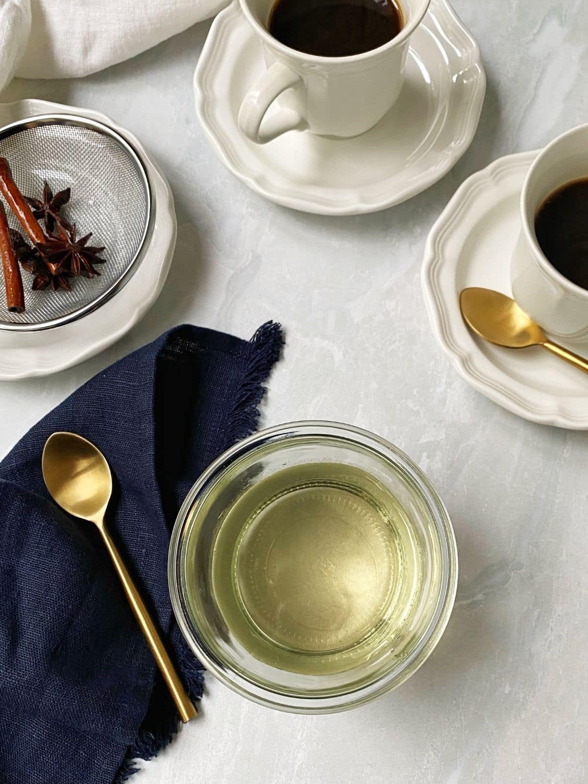 jar of syrup next to coffee cups