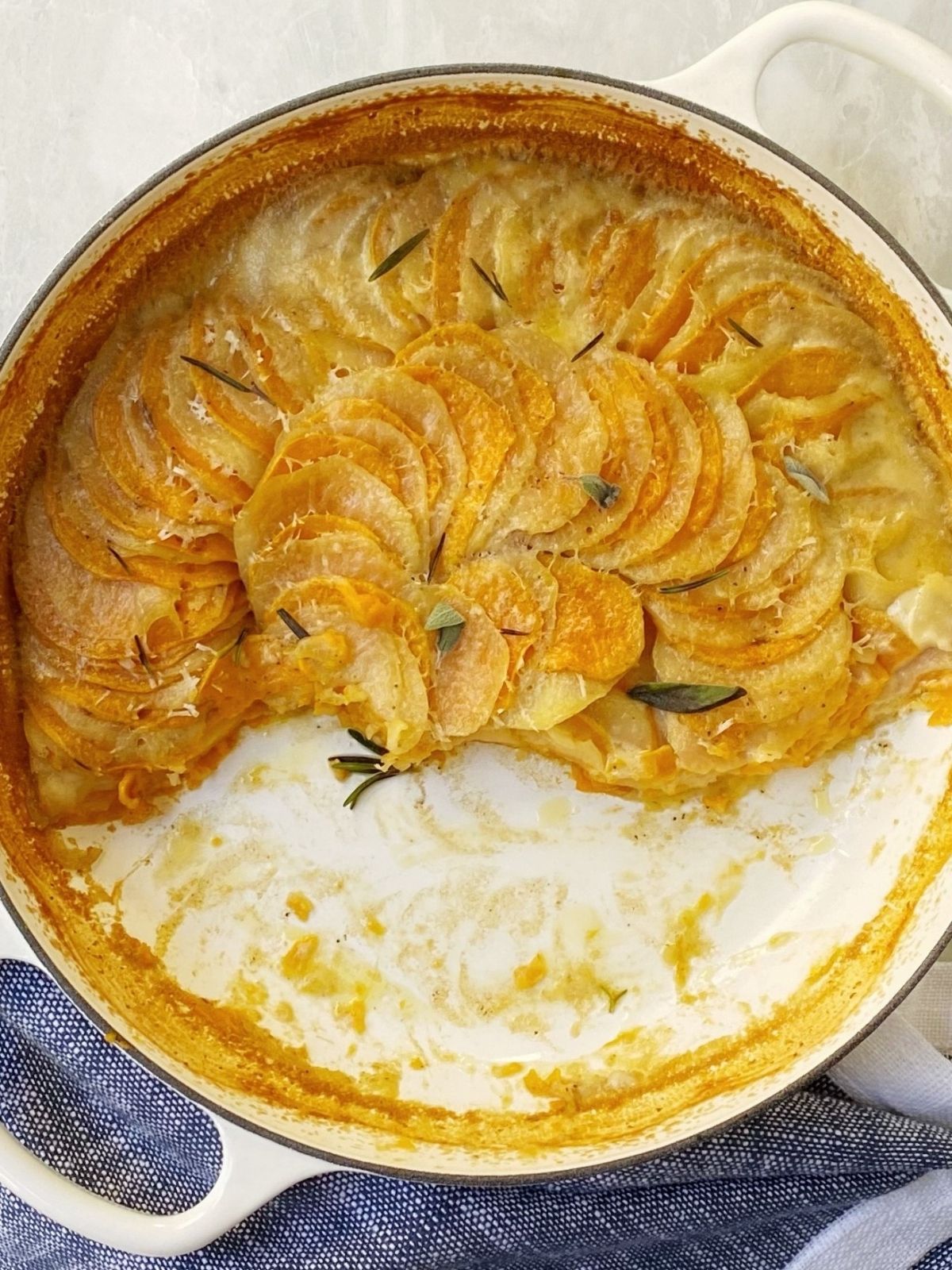 partially eaten casserole of sweet potato gratin