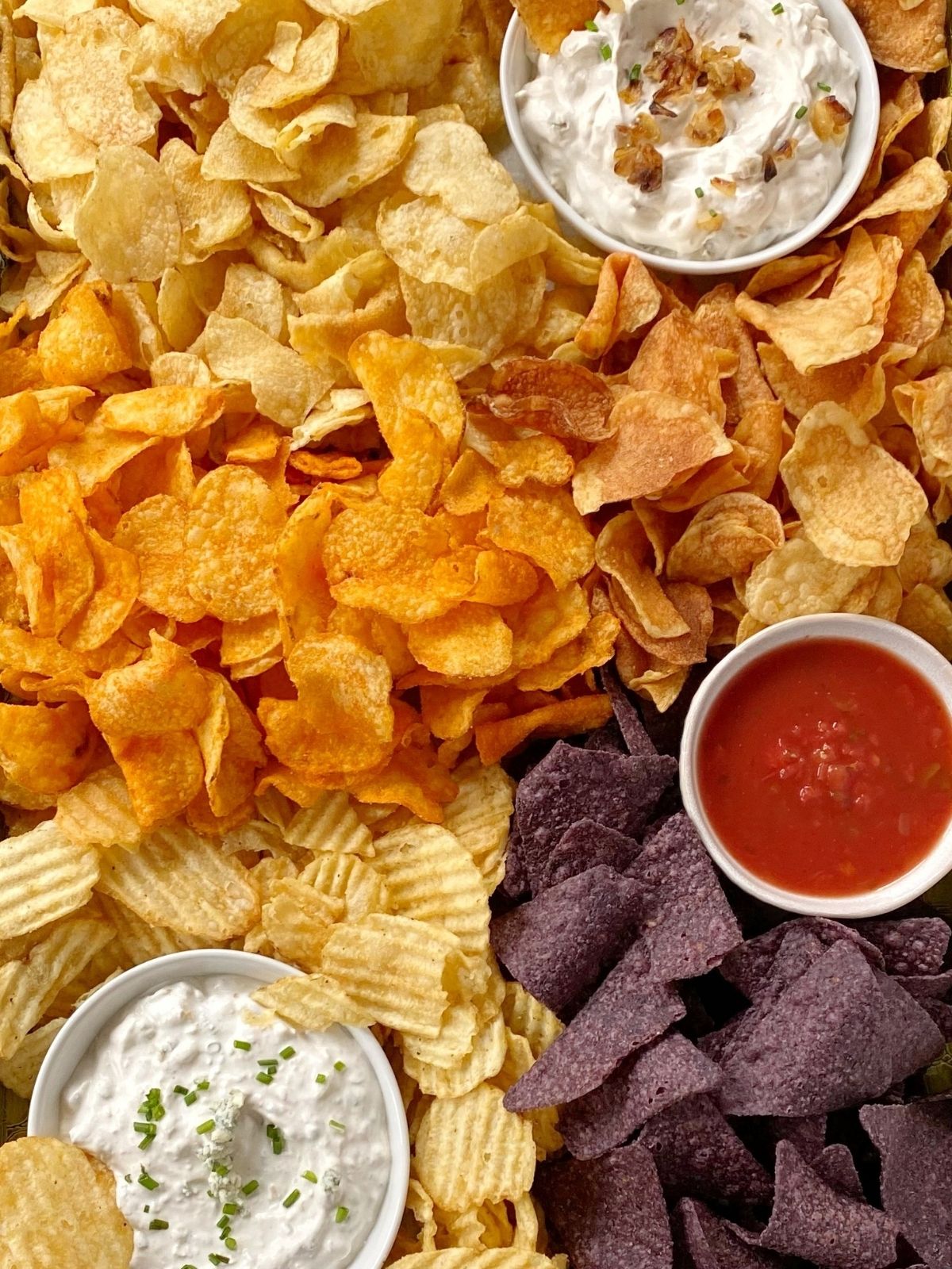 top down shot of chips and dip snack board