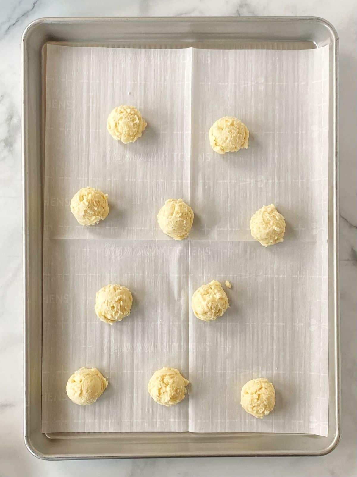 cookie dough portioned on sheet pan