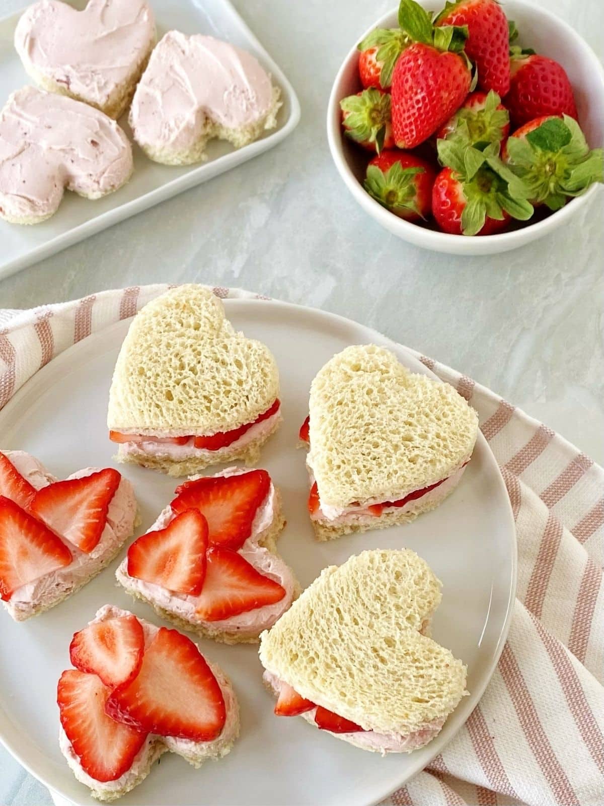 top down shot of tea sandwiches on a plate.