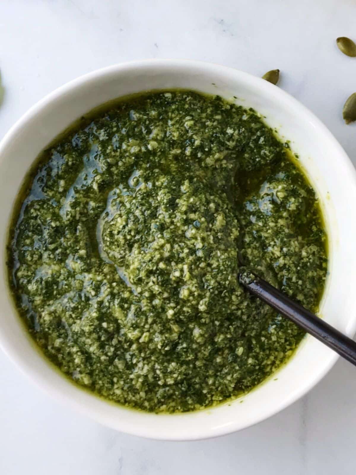 close up of bowl of pepita basil pesto