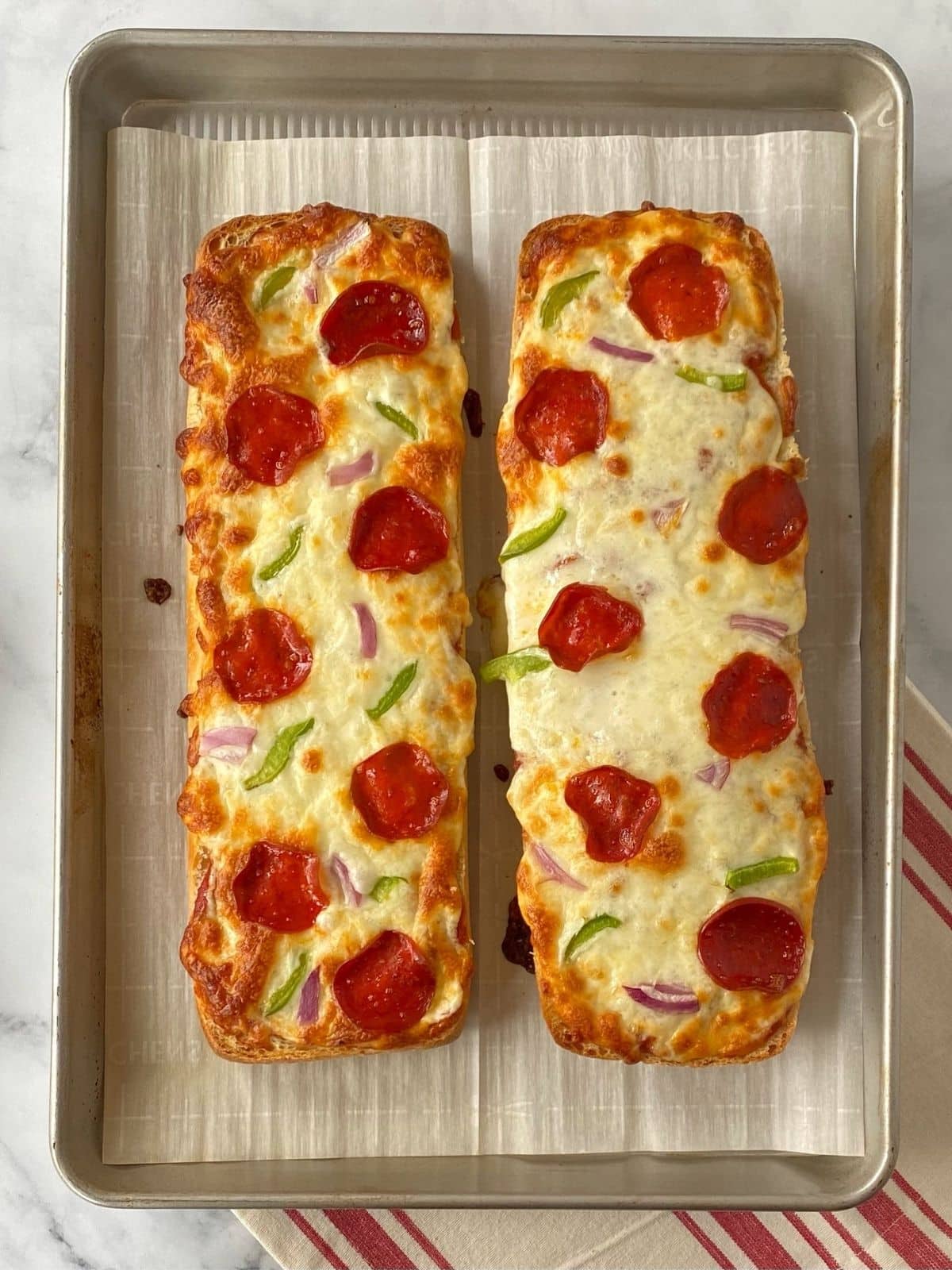 baked ciabatta pizza bread on a sheet pan.