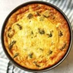 broccoli ham cheddar quiche in a deep dish pan.