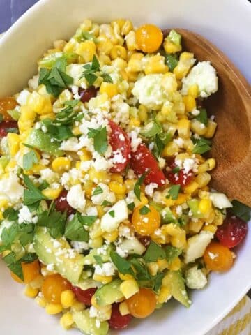 bowl of corn tomato avocado salad.