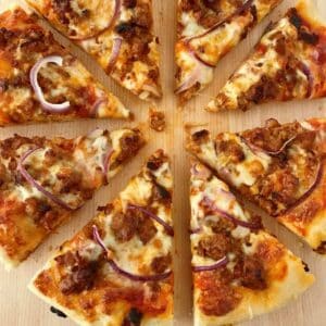 sliced sausage and onion pan pizza.