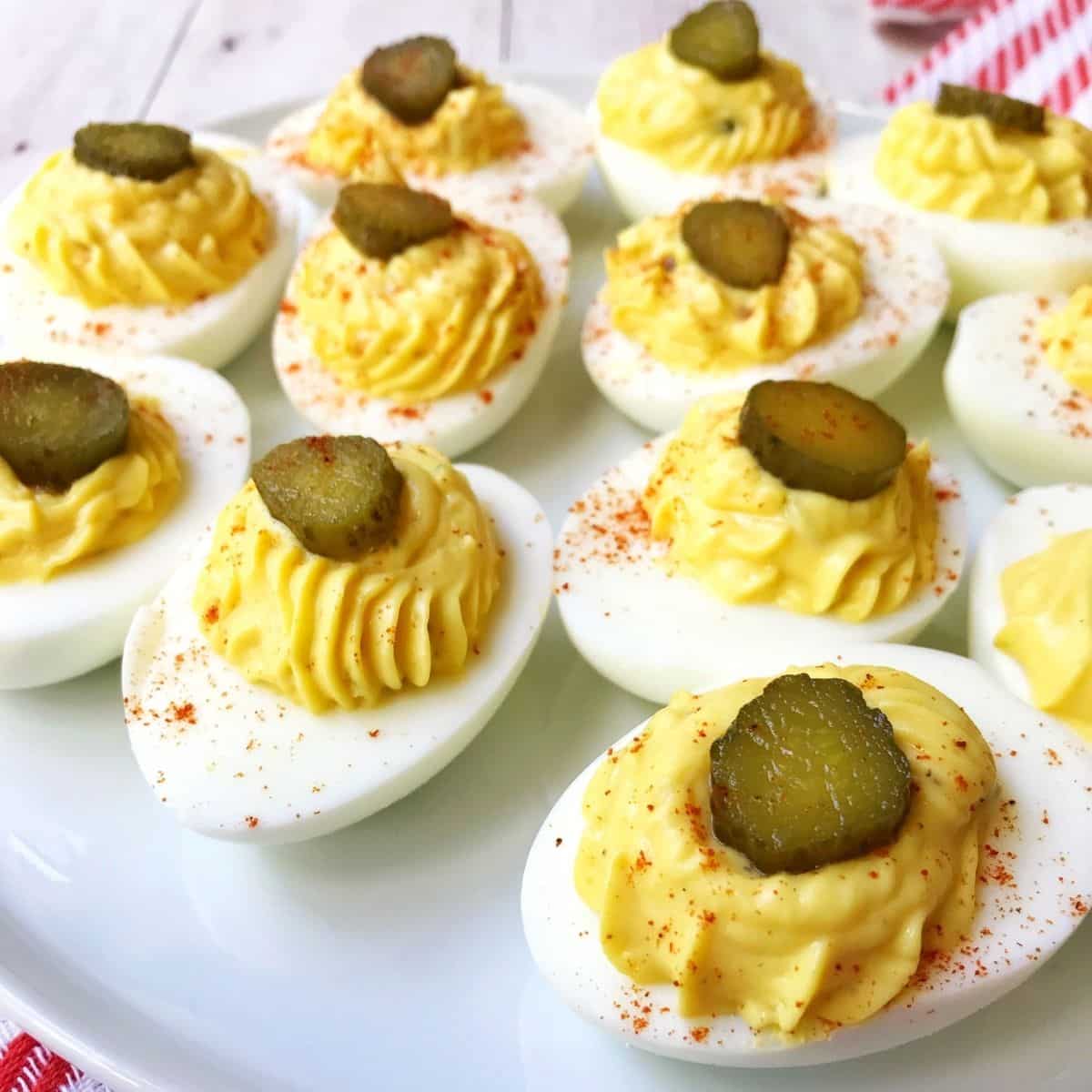 deviled eggs on a white platter.
