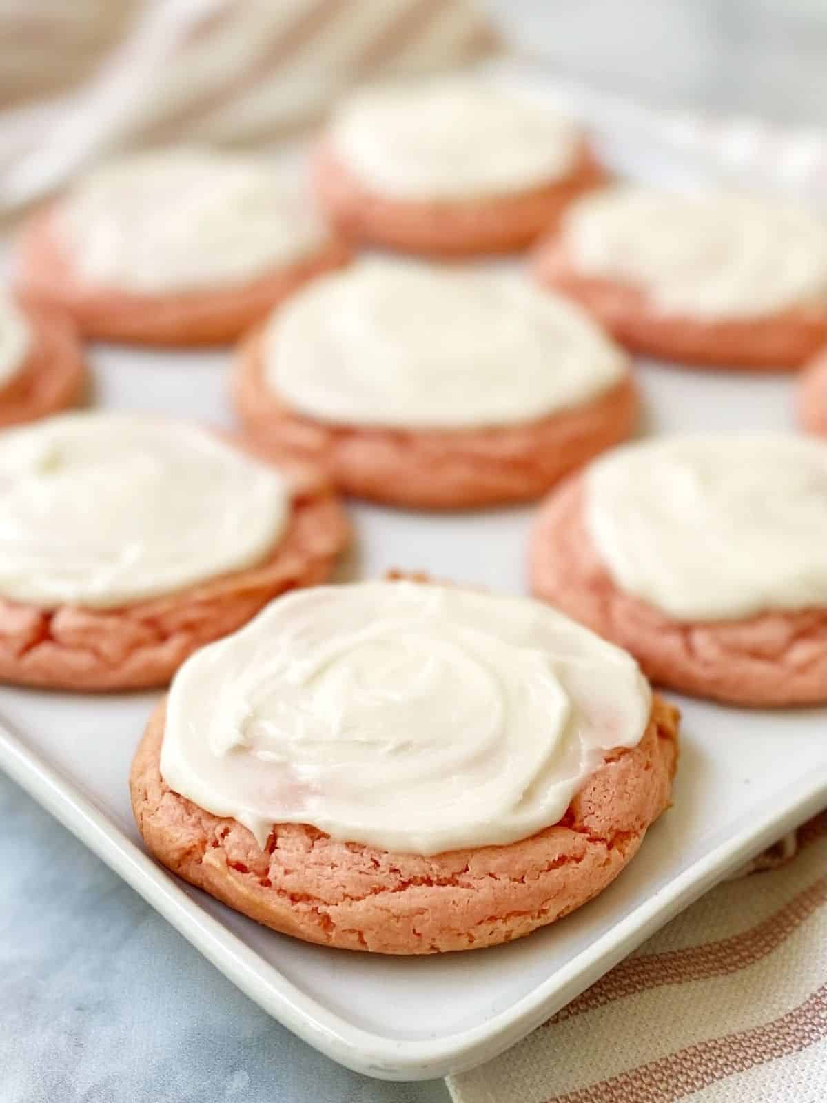 frosted cookies on a plate.
