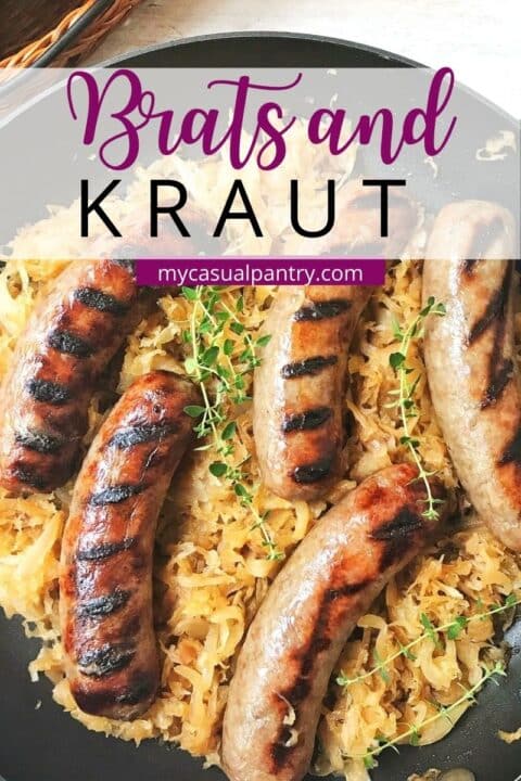 grilled brats with sauerkraut in a skillet.