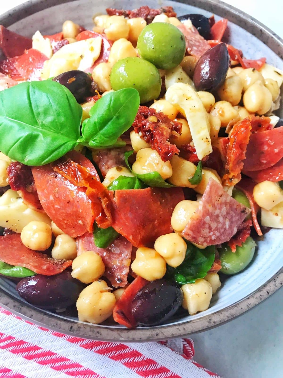 close up of antipasto salad in a bowl.