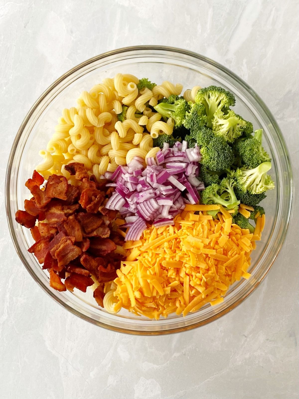 combine salad ingredients in a mixing bowl.