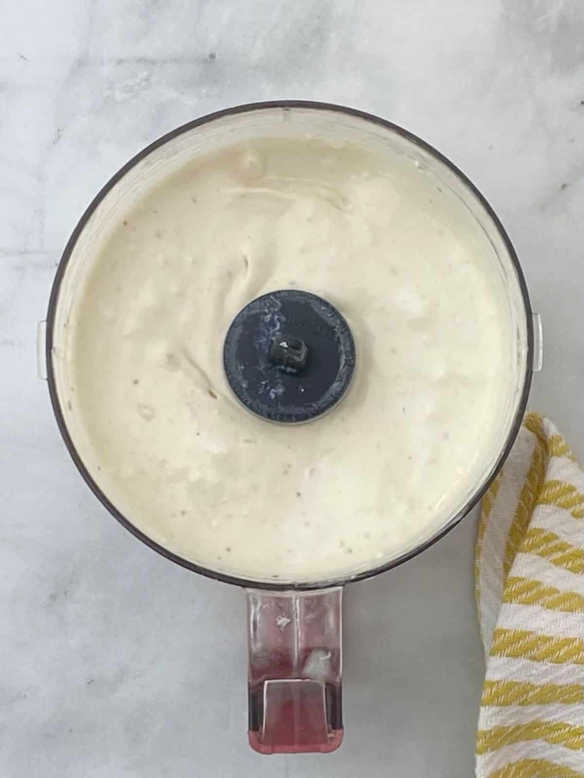 blending blue cheese sauce in food processor.