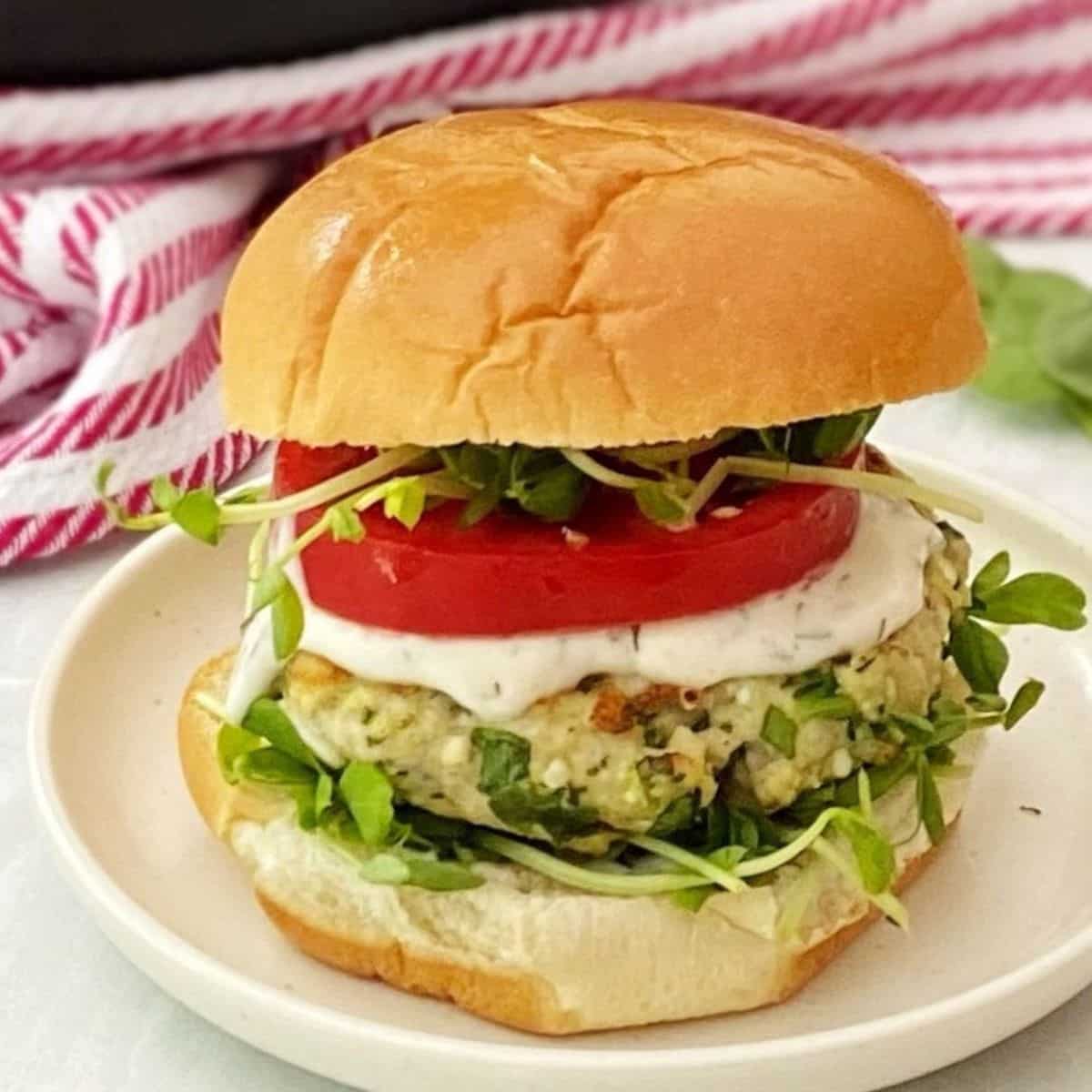 side view of spinach feta chicken burger.