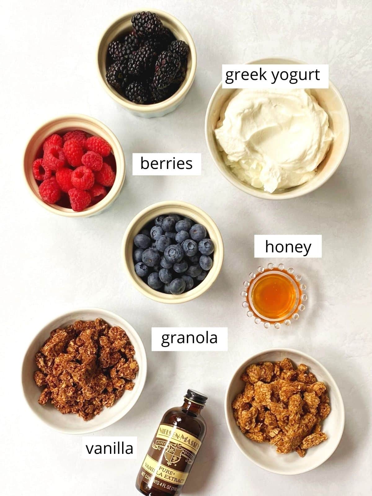 ingredients for greek yogurt with berries and granola.