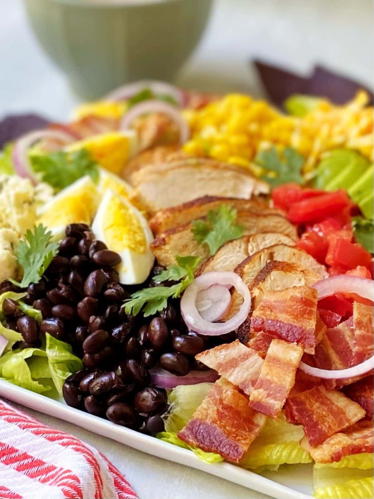 side view close up of cobb salad on platter.