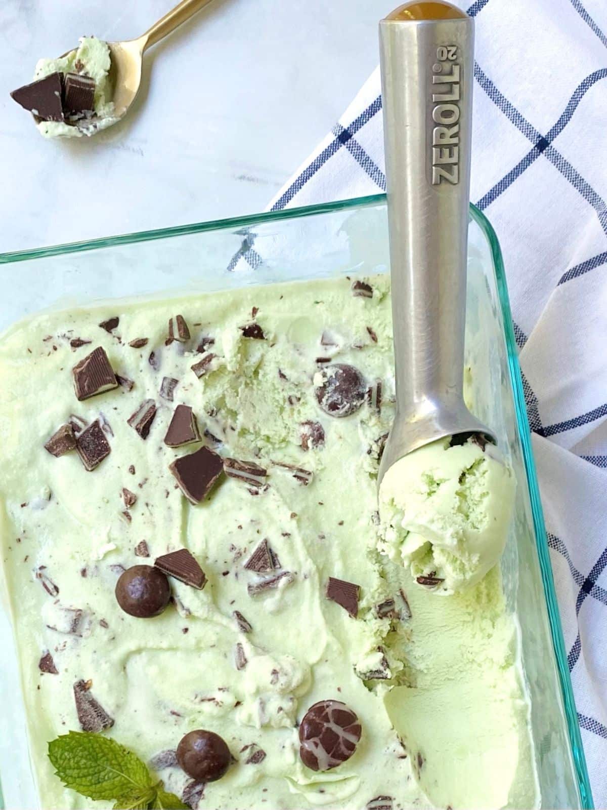 mint ice cream with ice cream scoop.