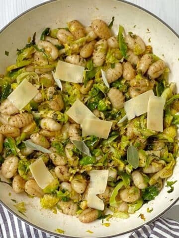 overhead shot of skillet of gnocchi and brussels.