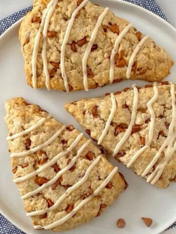 close up of three scones on a plate.
