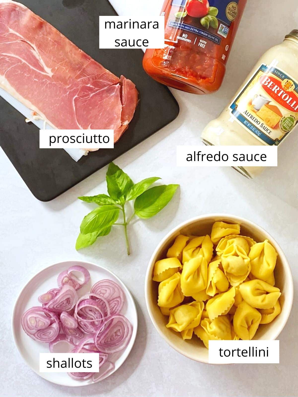 ingredients for tortellini pasta in pink sauce.