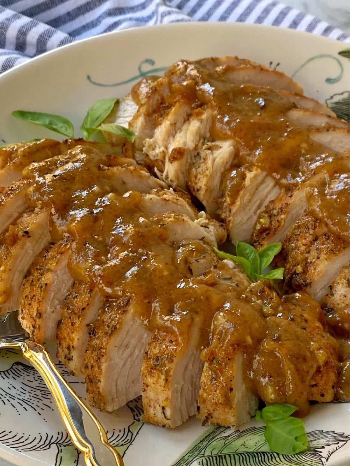 side view of sliced turkey on a platter.