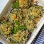 white baking dish of breadcrumb topped stuffed mushrooms.