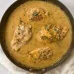 top down shot of herb chicken in skillet.