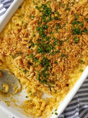 white casserole dish of baked mac and cheese.