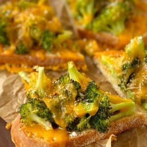 side view close up of broccoli cheddar toasts.