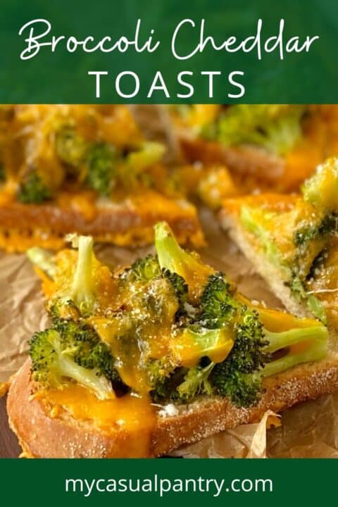 close up of broccoli cheddar toasts on a board.