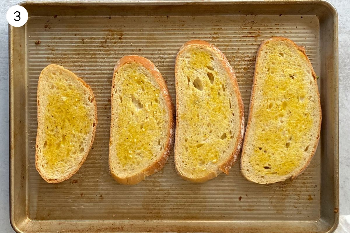 sheet pan of bread brushed with olive oil.