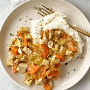 top down of plate of creamy chicken with mashed potatoes.
