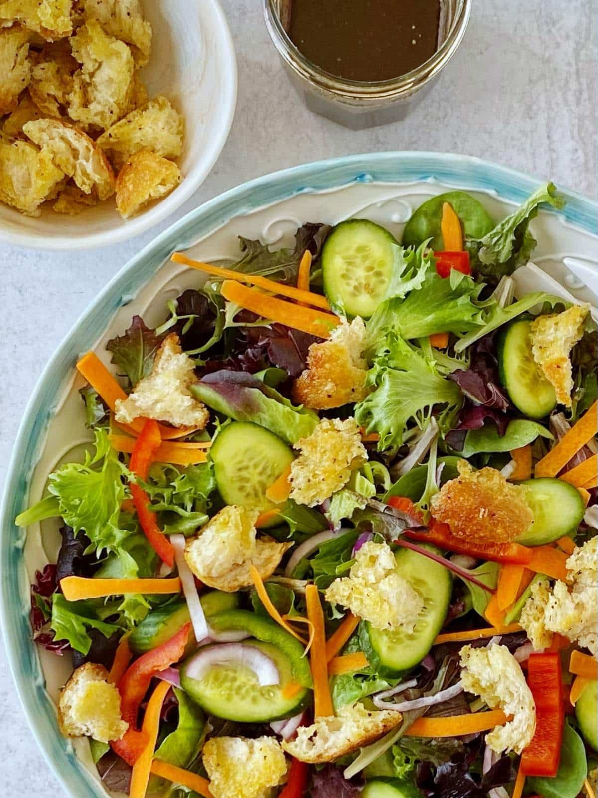 top down shot of house salad in a serving bowl.