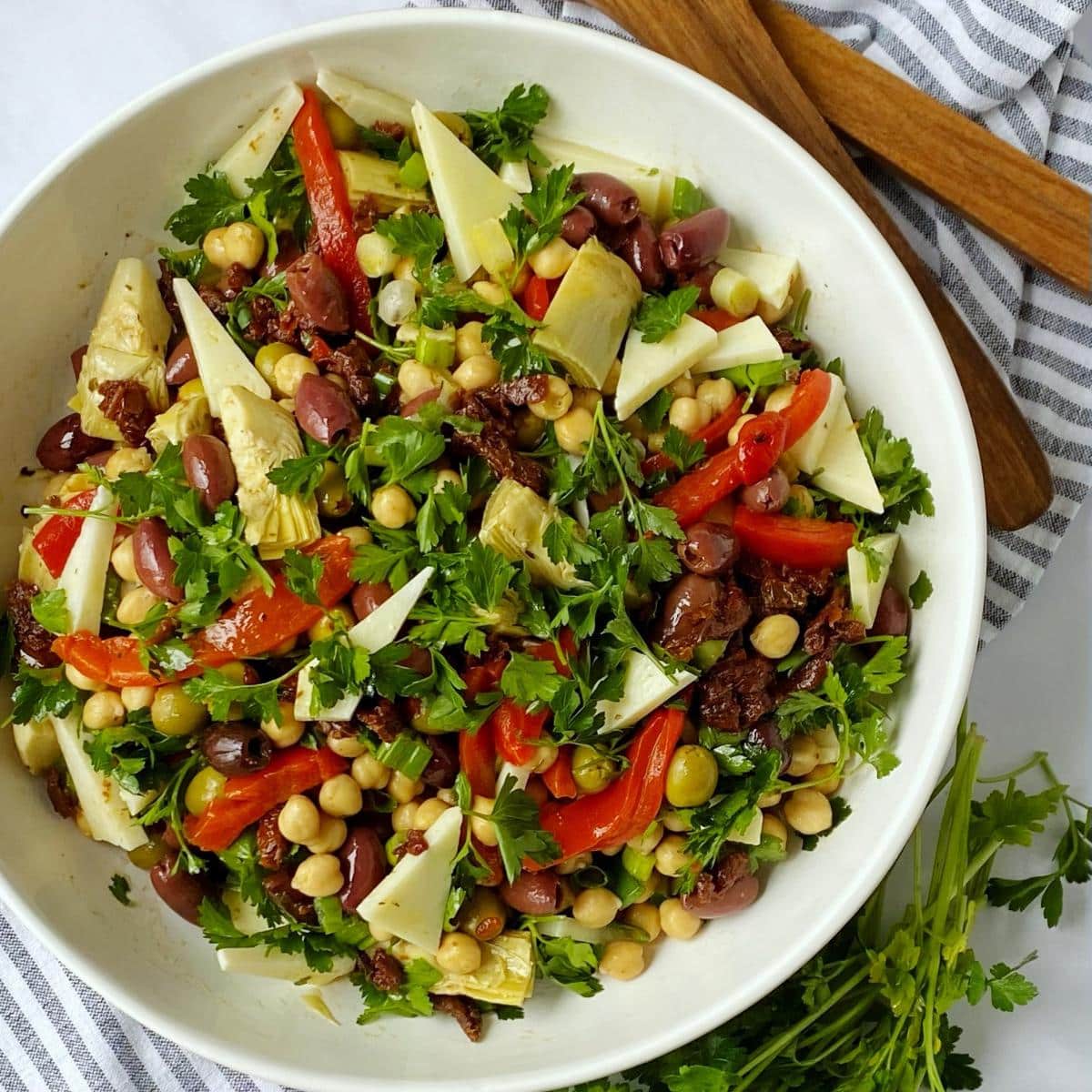 top down shot of salad in a white serving bowl.