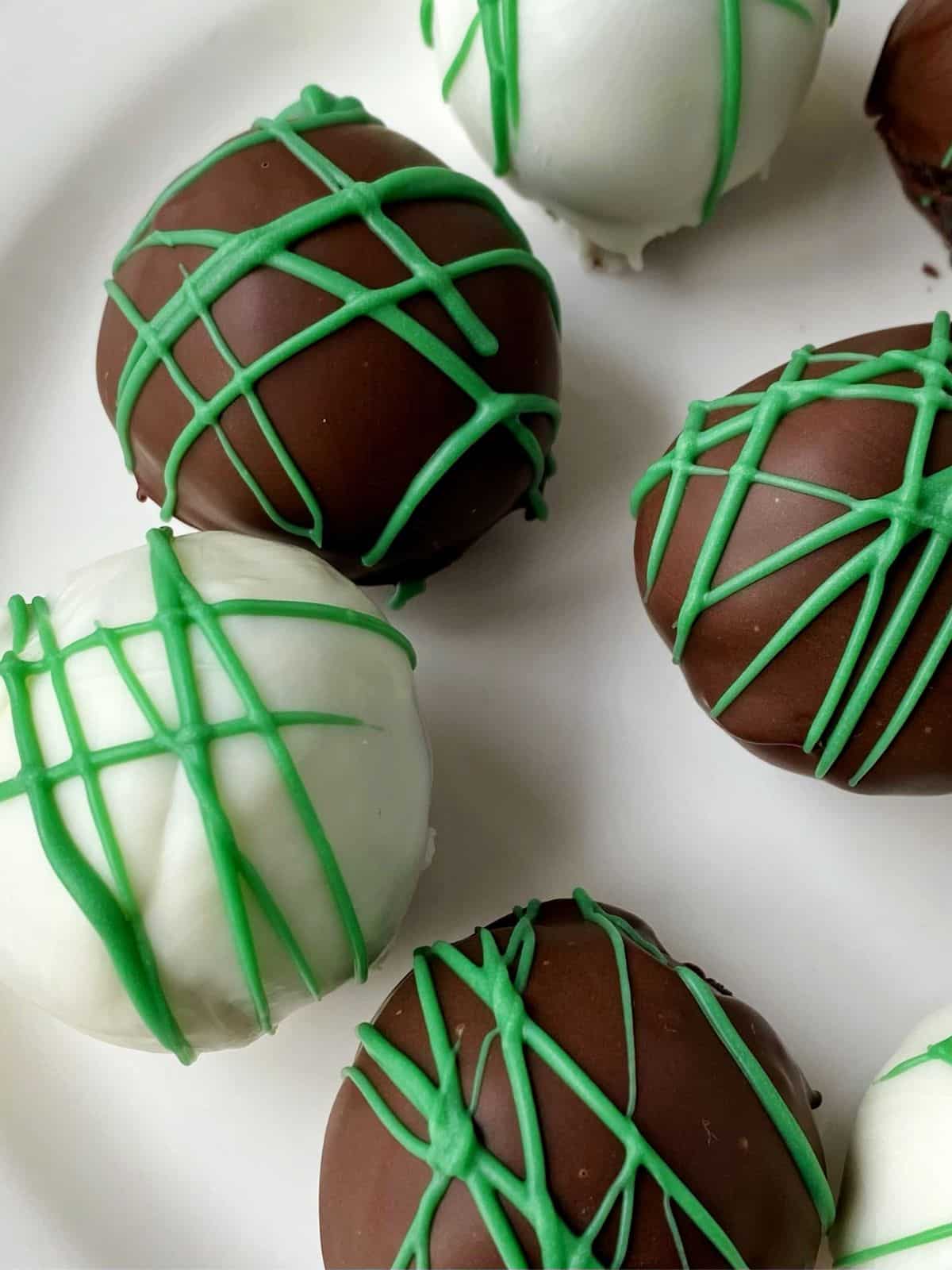 close up of oreo ball truffles on a plate.