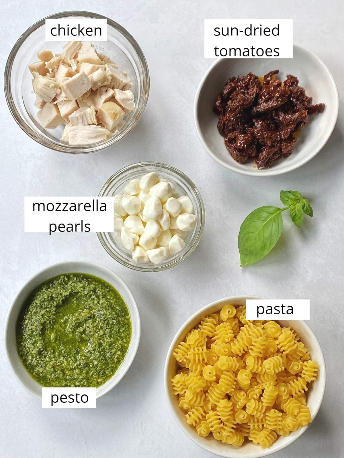Ingredients for chicken pesto pasta salad.