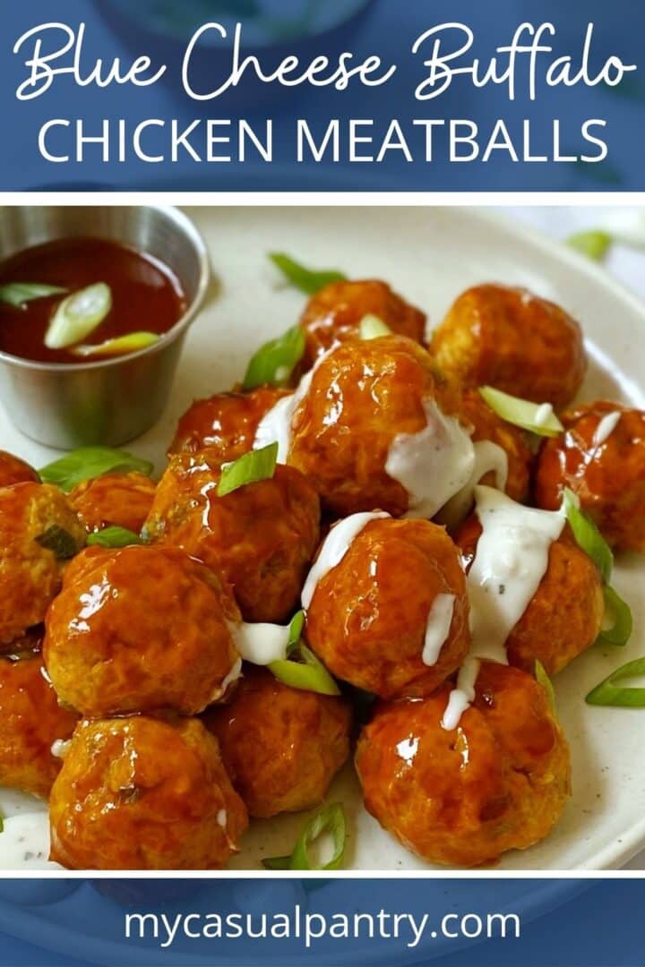 plate of buffalo chicken meatballs topped with a drizzle of blue cheese dressing.