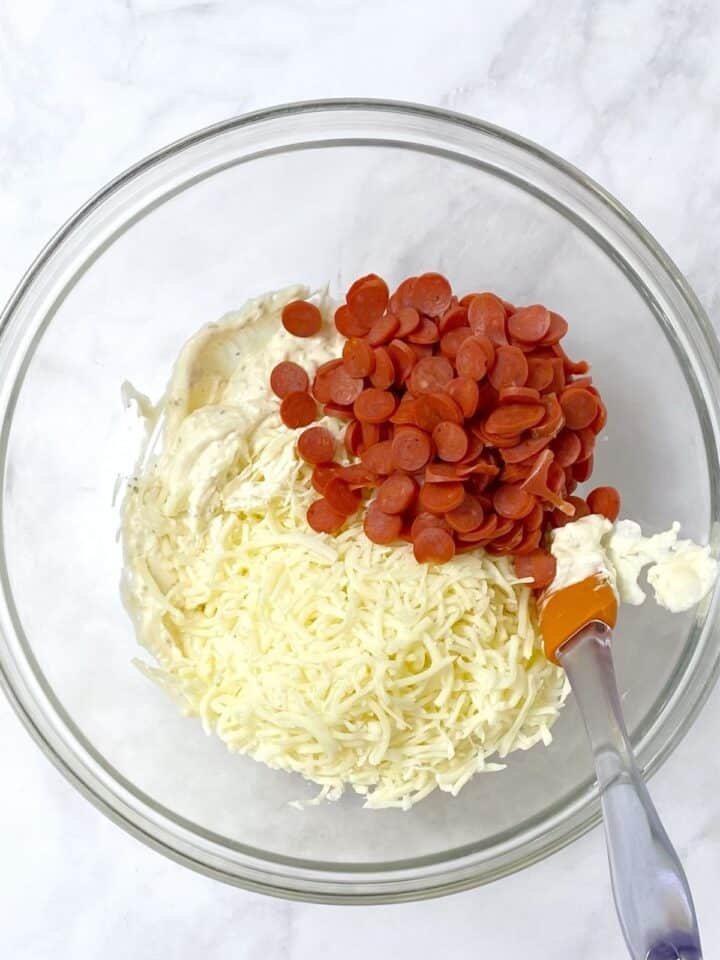 stir in pepperoni and mozzarella cheese into mayo mixture.