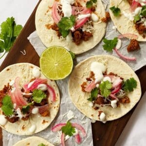 chorizo tacos with pickled red onions, lime crema, and cilantro.