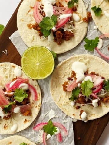 chorizo tacos with pickled red onions, lime crema, and cilantro.