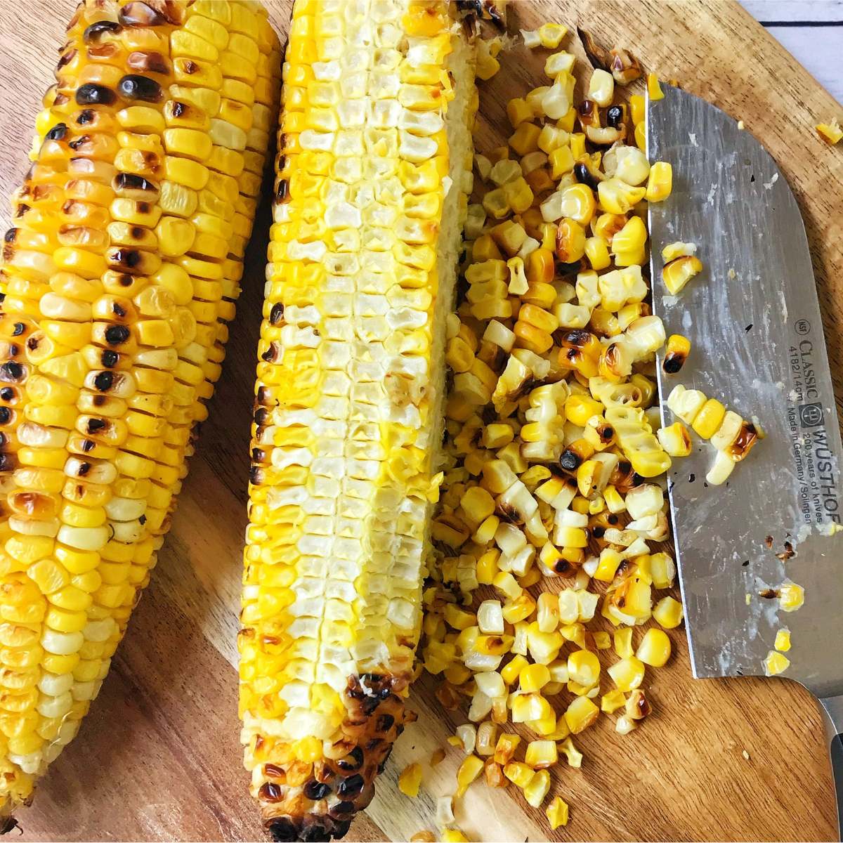 cutting corn off of cob.