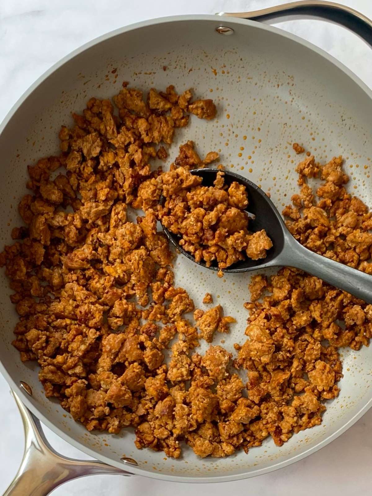 browning chorizo in a skillet.