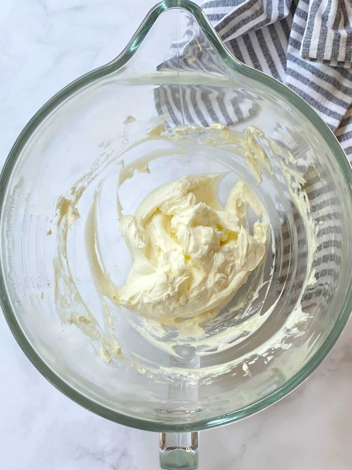whip cream cheese with cream in mixing bowl.
