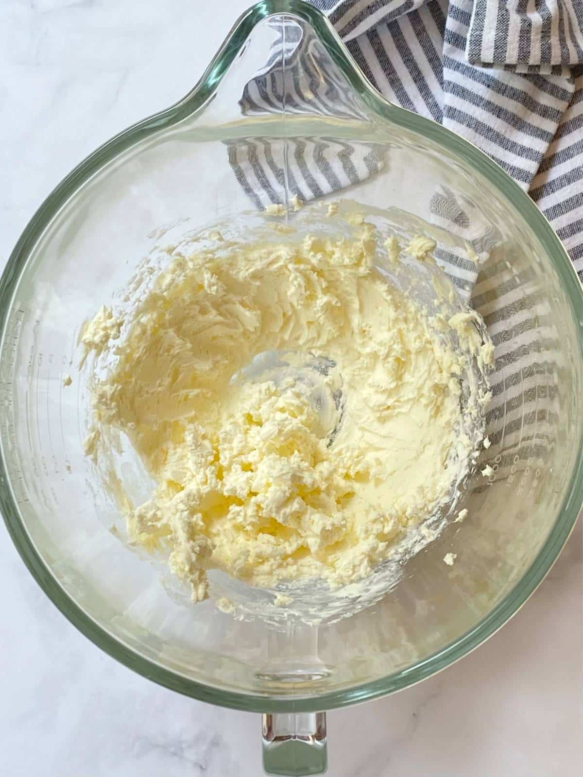 whip cream cheese in a mixing bowl to soften.