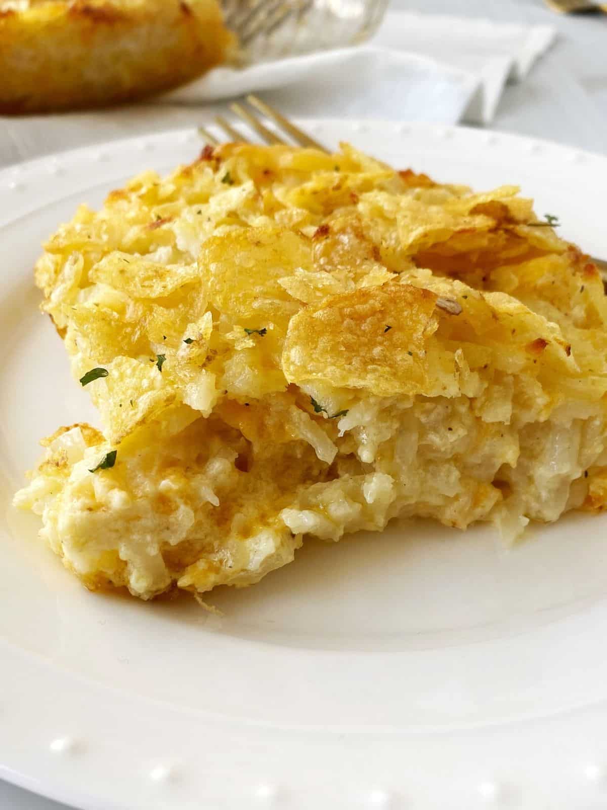 plate of cheesy hash brown casserole.