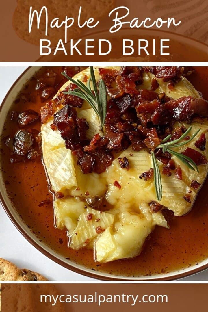 A plate of baked Brie topped with bacon and maple syrup.