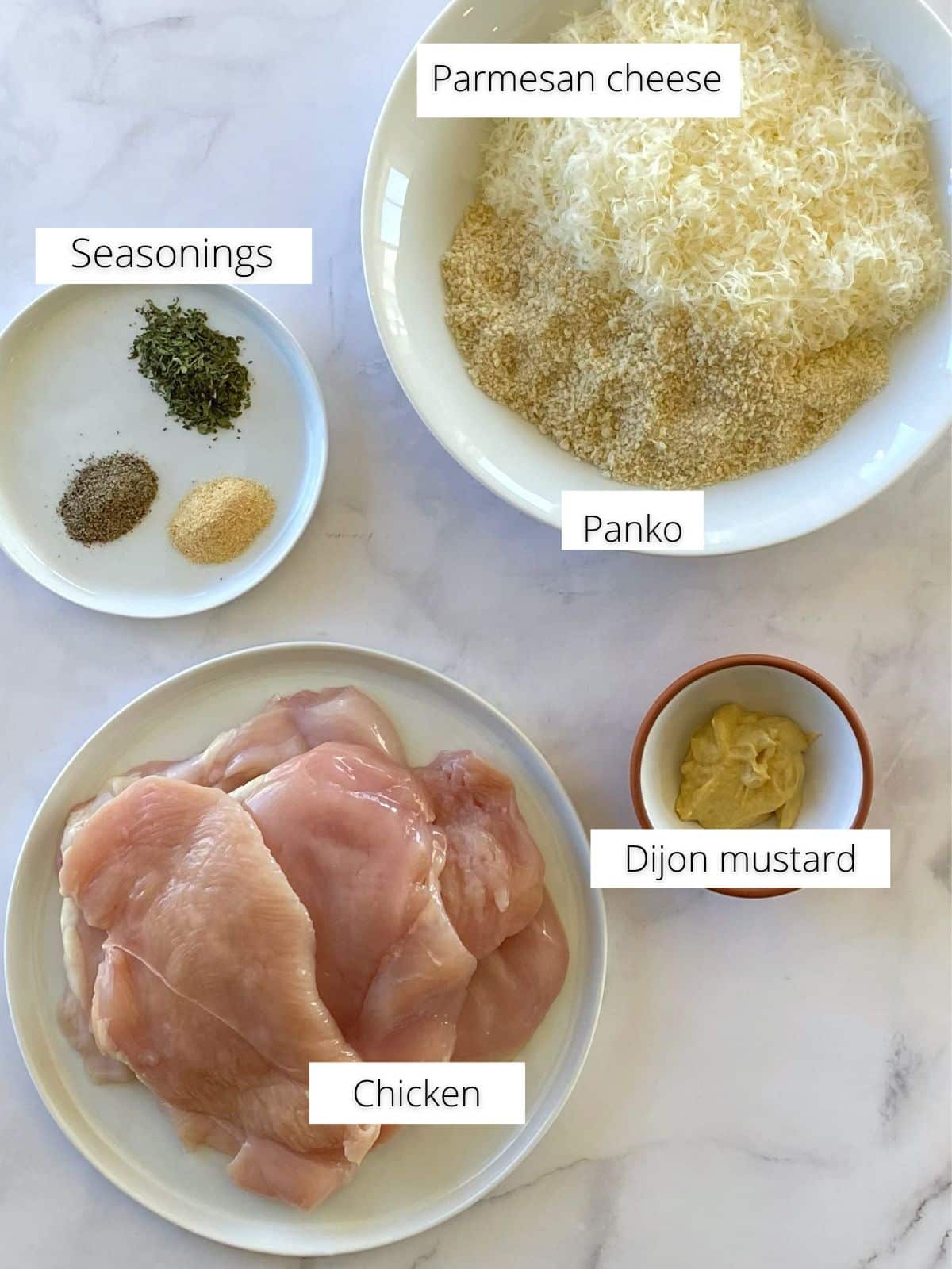 Ingredients for baked Parmesan crusted chicken cutlets.