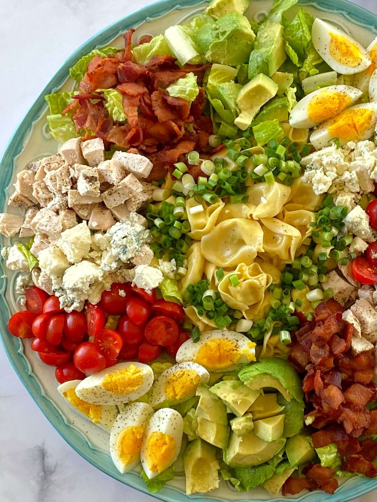 Cobb salad on a serving platter off centered.