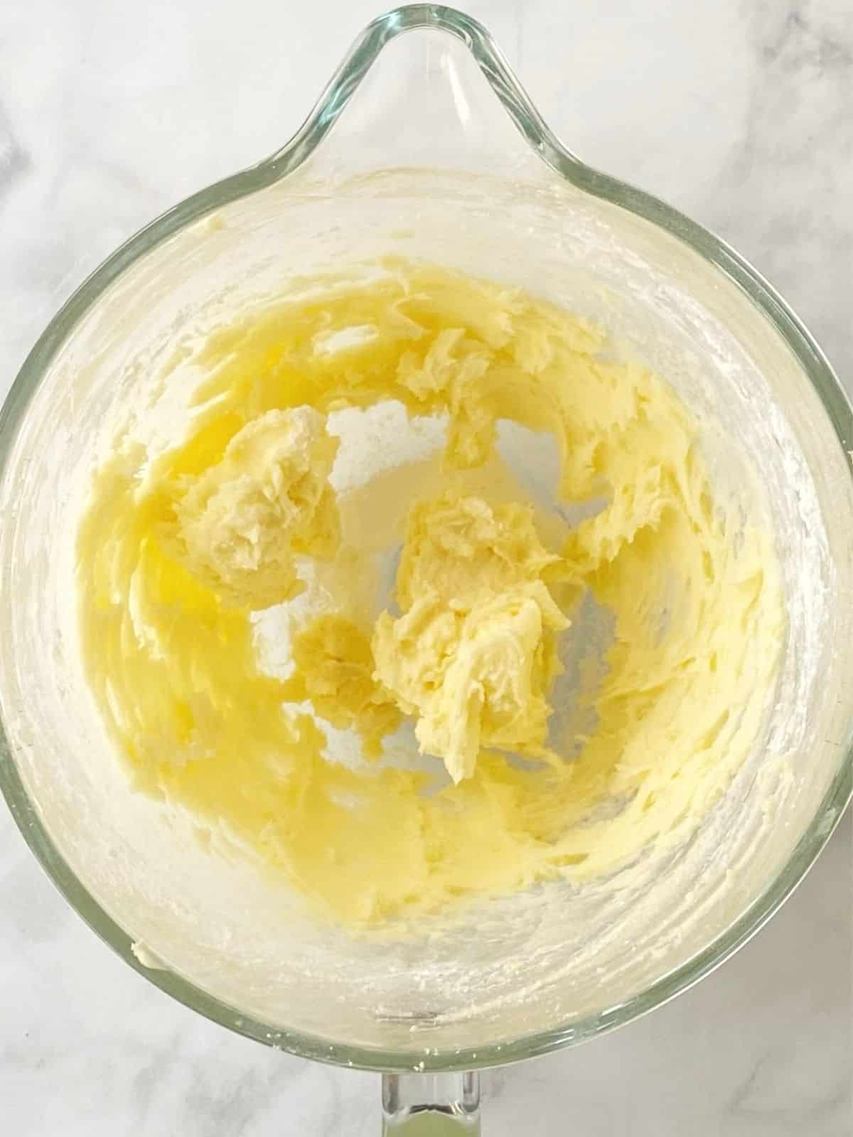 Creaming butter and sugar in mixing bowl.